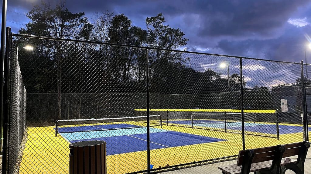 Lighted pickleball courts at dusk - CPM Construction project